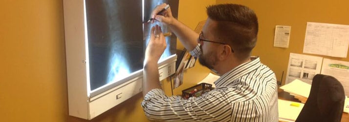 Chiropractor Chattanooga TN Davy Addison analyzing an x-ray