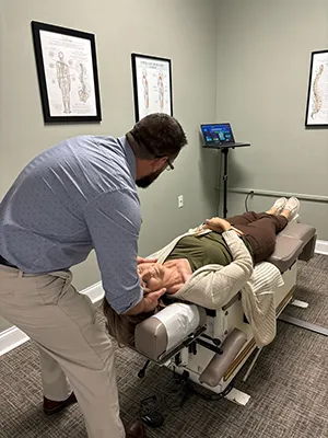 Chiropractor Chattanooga TN Davy Addison Adjusting Patient